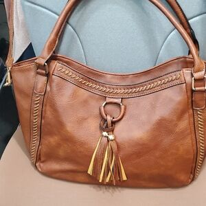 Non branded vinyl, looks like leather satchel/crossbody